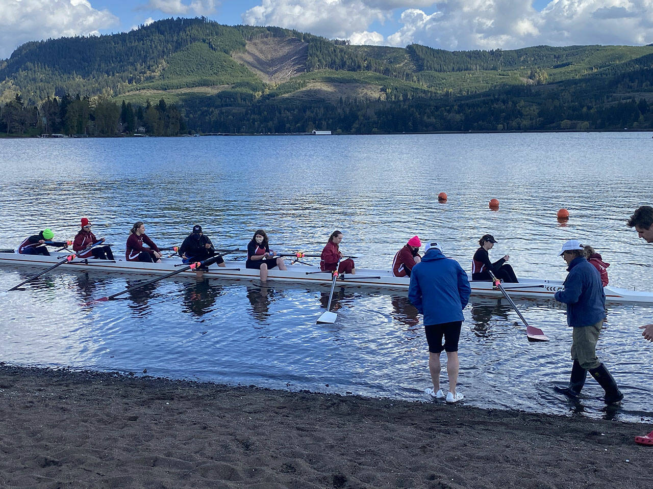 (Eric Odegard Photo) Burton Beach Rowing Club (BBRC) Jr. Women launch their 8 from the shore of Lowell Lake. BBRC took home ten medals at the Oregon event.