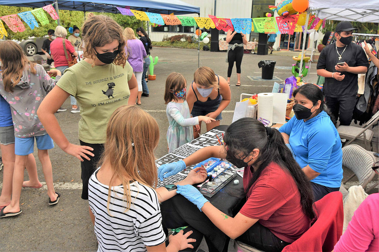 (Jim Diers Photo) Last summer’s Mercado, presented by Comunidad Latino de Vashon, was also held at the Sheffield Building, offering food, gifts, and community fun.
