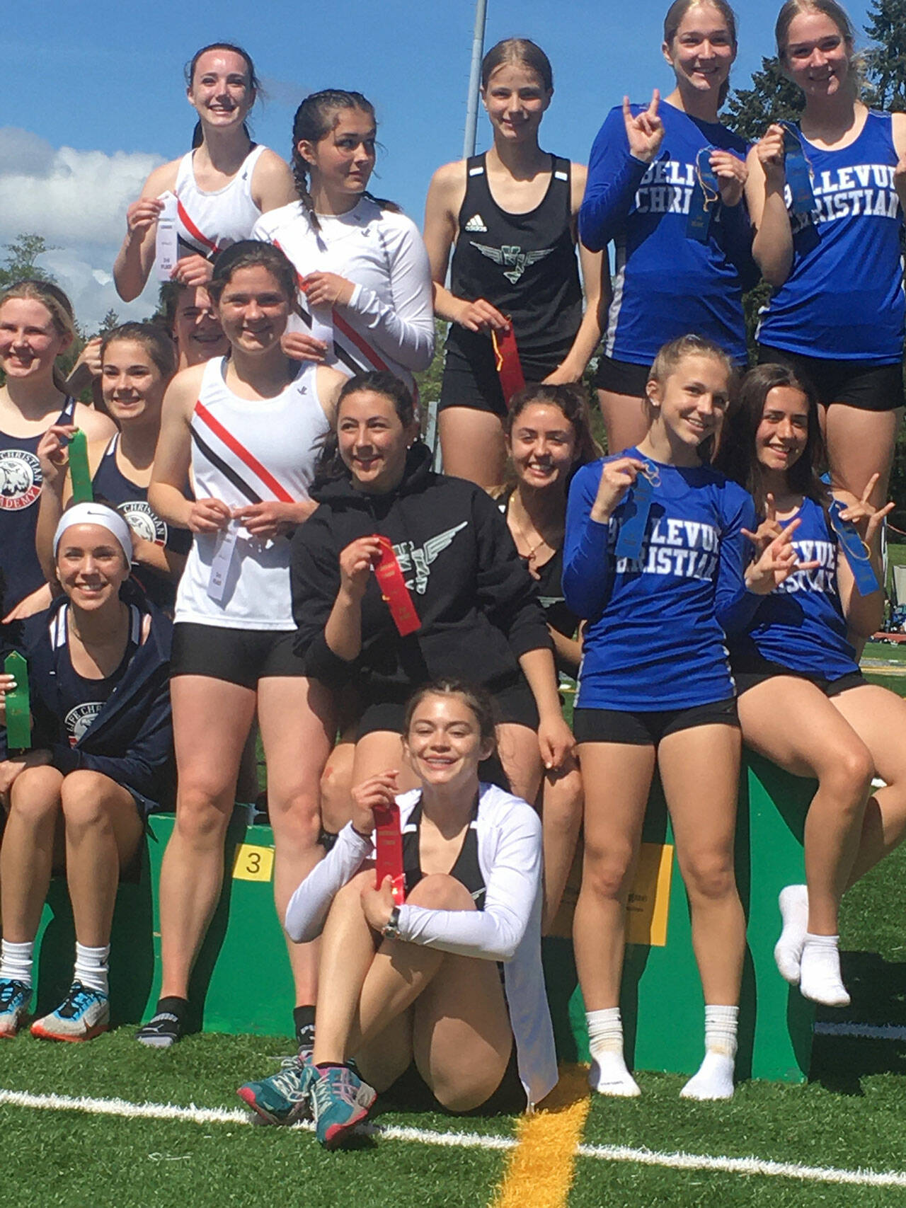 (Kevin Ross Photo) VHS Girls 4x1 relay team, on the awards podium after finishing in second place with a time of 54.70. Pictured in the black singlets, Annabel Moeckel (top) Amelia Medeiros (middle left) Nicki Becker (middle right) Alana Bass on the bottom. Not pictured is team captain Phoebe Wilke who was injured earlier in the week and could not participate in the relay.