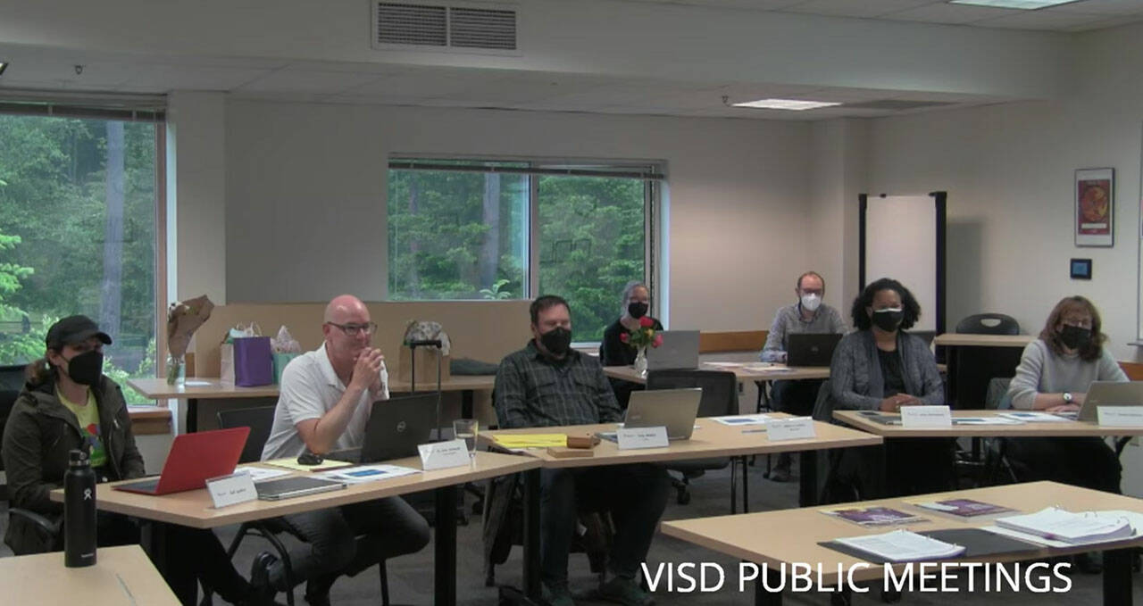 (Screenshot | Vashon School District YouTube) At a June 9 school board meeting, the school board and Superintendent Slade McSheehy (second from left, at table) discussed matters including masking requirements and recommendations recently put in place in the district after a COVID-19 outbreak at Vashon High School.
