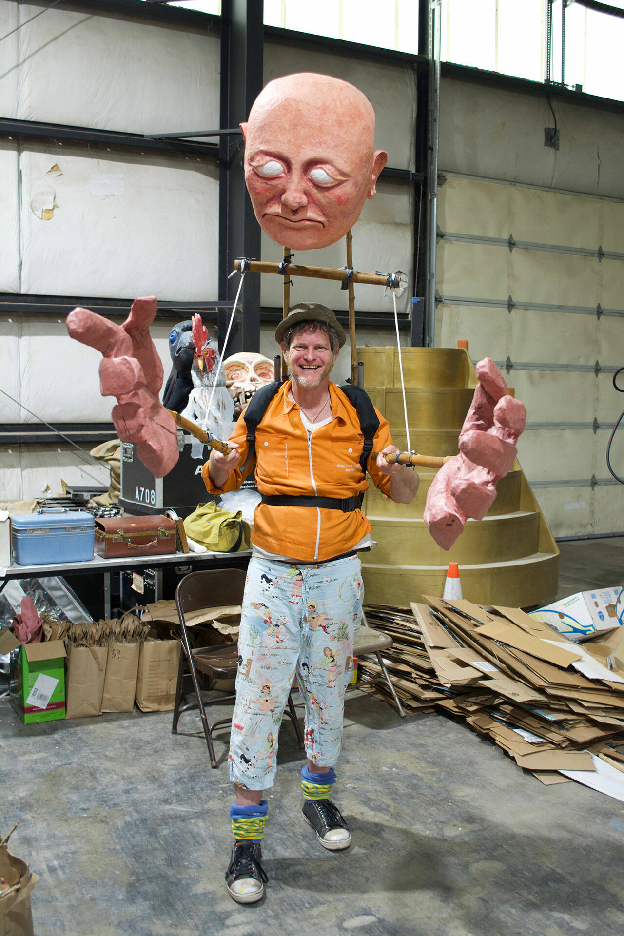 (Jenna Dennison Photo) Adam Ende, wearing one of the giant puppets that will be featured in Saturday’s parade and pageant.