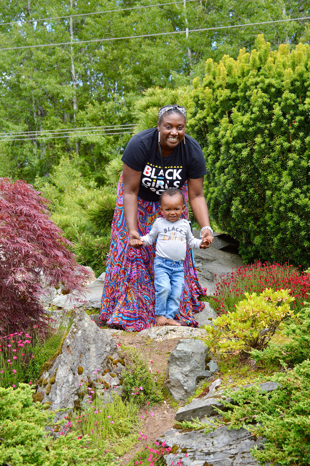 (Christina Arthur Photo) LaTriece Arthur and son Zoli Arthur enjoyed the foliage at Mukai Farm & Garden during Sunday’s Juneteenth event.