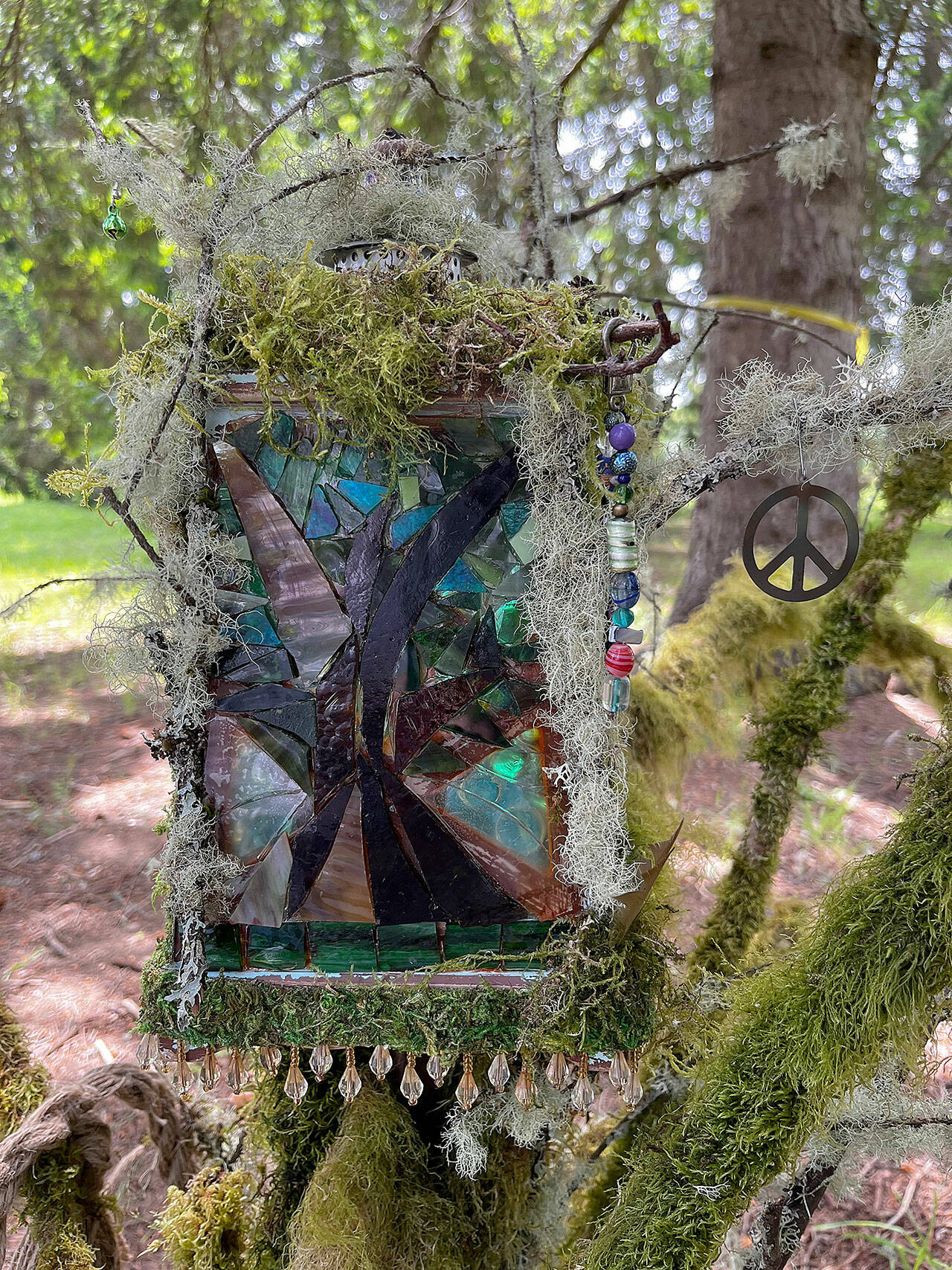 (Courtesy Photo) Islanders can find this tiny fairy house and others, tucked among the trees in the Douglas fir grove at Open Space for Arts & Community.