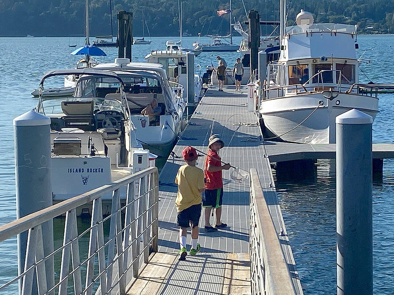 Last Saturday, the re-opened Dockton Marina was lively, with boaters, sunbathers and even a small band of intrepid fisherman on the pier. (Tom Hughes Photo)