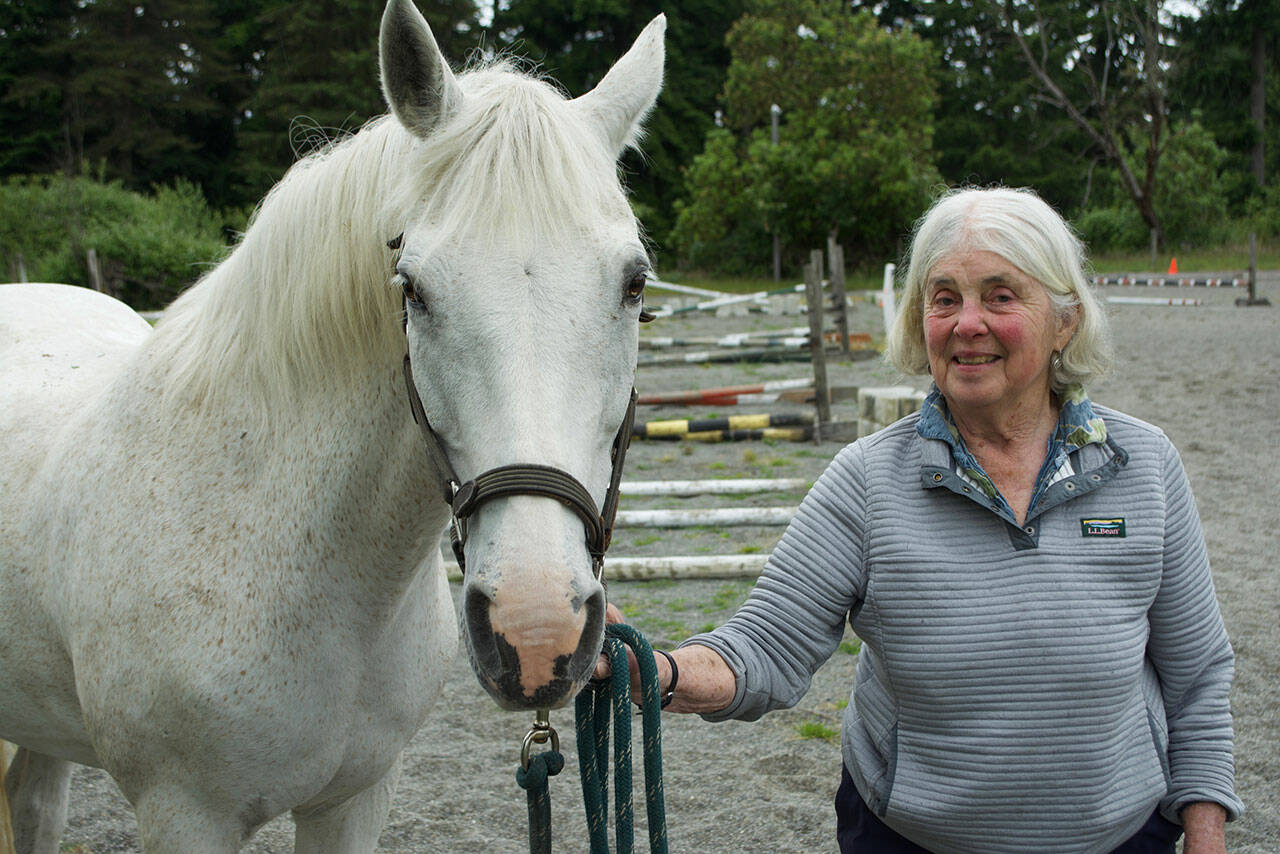 (Jenna Dennison Photo) Fran O’Reilly with her horse, Jewel, at her home on Maury Island.