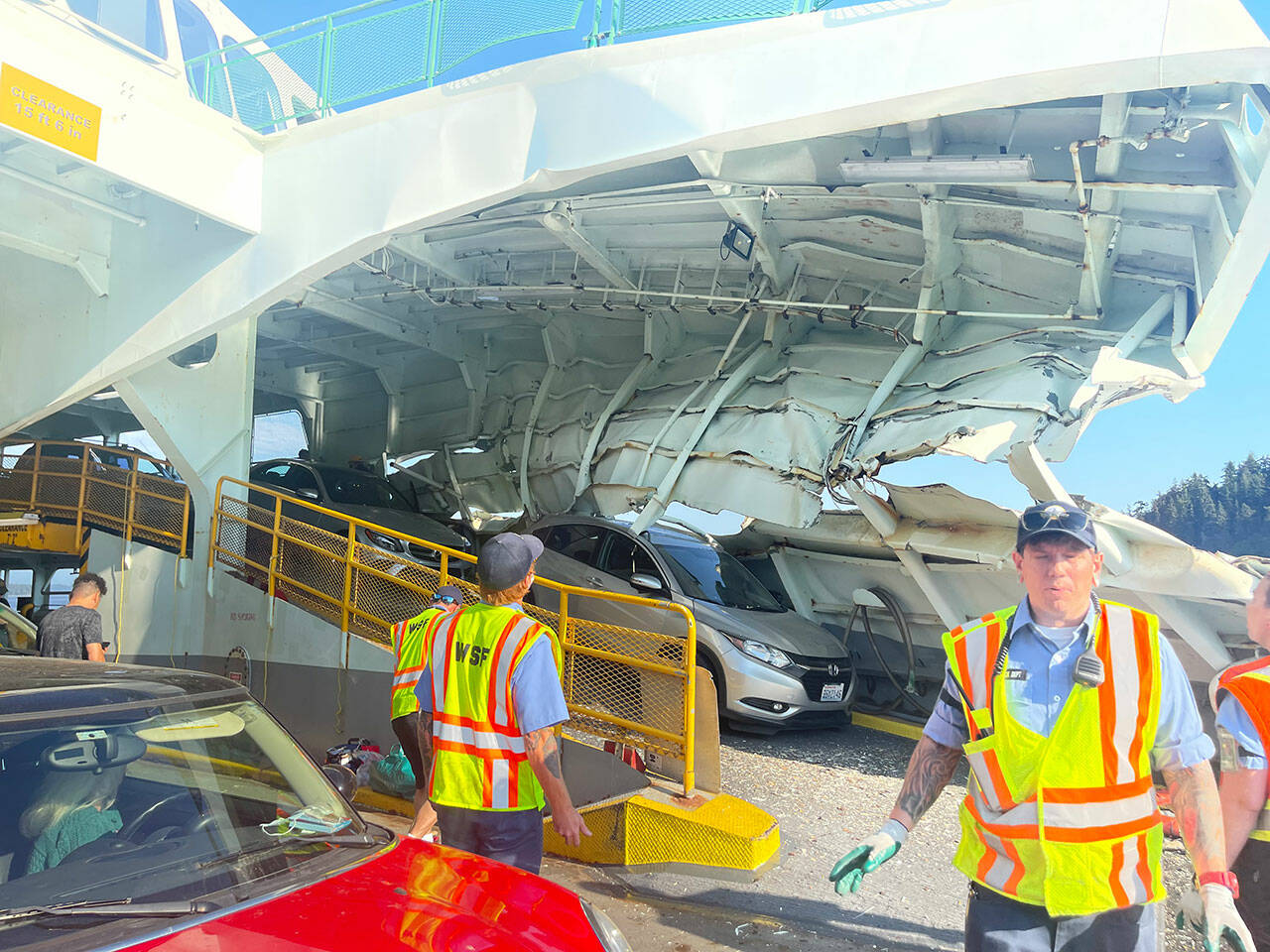 Immediately after the crash, islander Pam Kirkpatrick captured the chaotic scene, showing metal folded over the tops of cars on the left side of the boat. (Pam Kirkpatrick Photo)