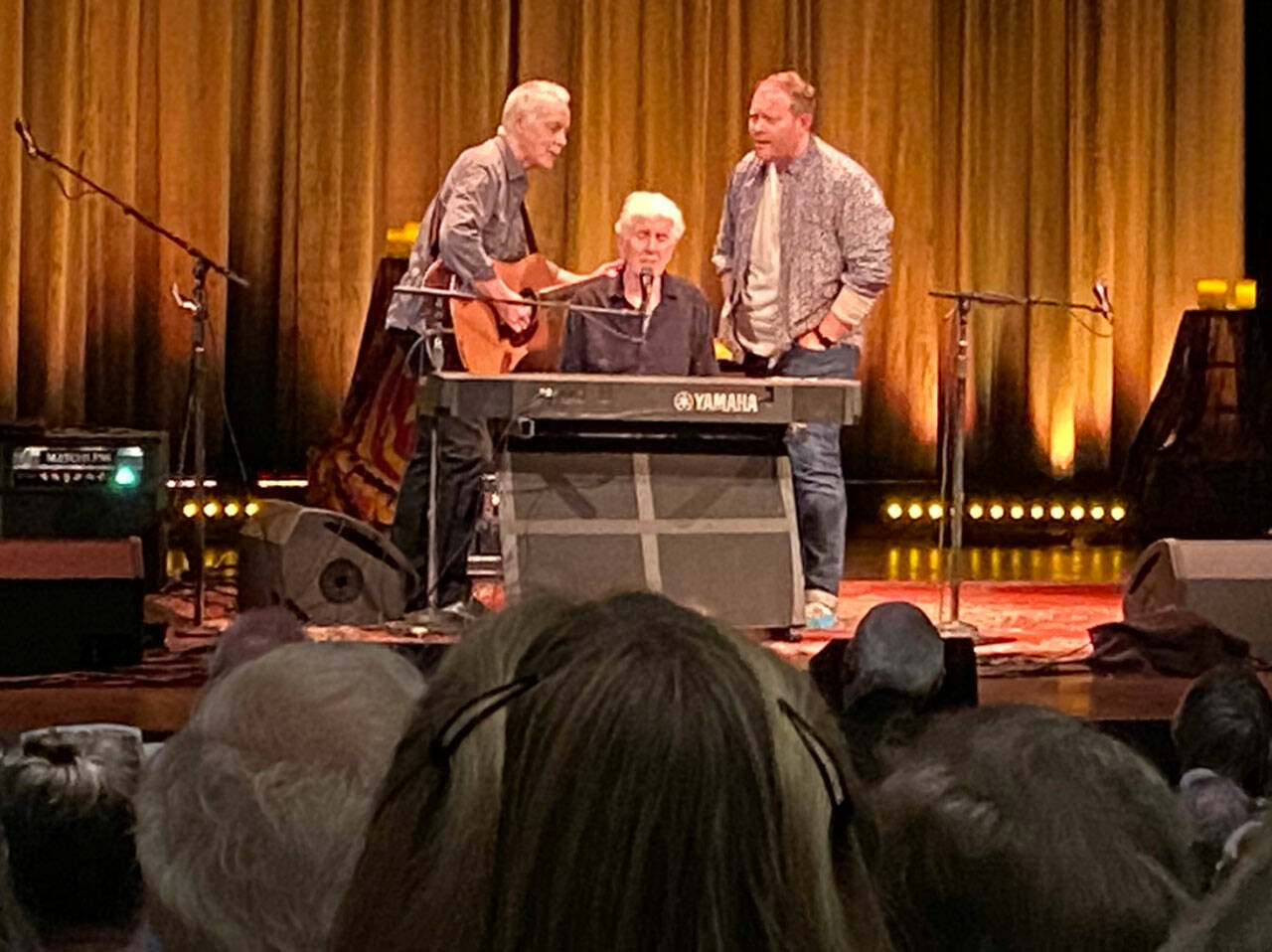 In one of three encores to his concert at VCA, Graham Nash (center) joined by his collaborators Shane Fontayne (left) and Todd Caldwell (right) brought some in the crowd to tears with a poignant and perfectly harmonized rendition of Buddy Holly’s famous song, “Everyday” (Tom Hughes Photo).