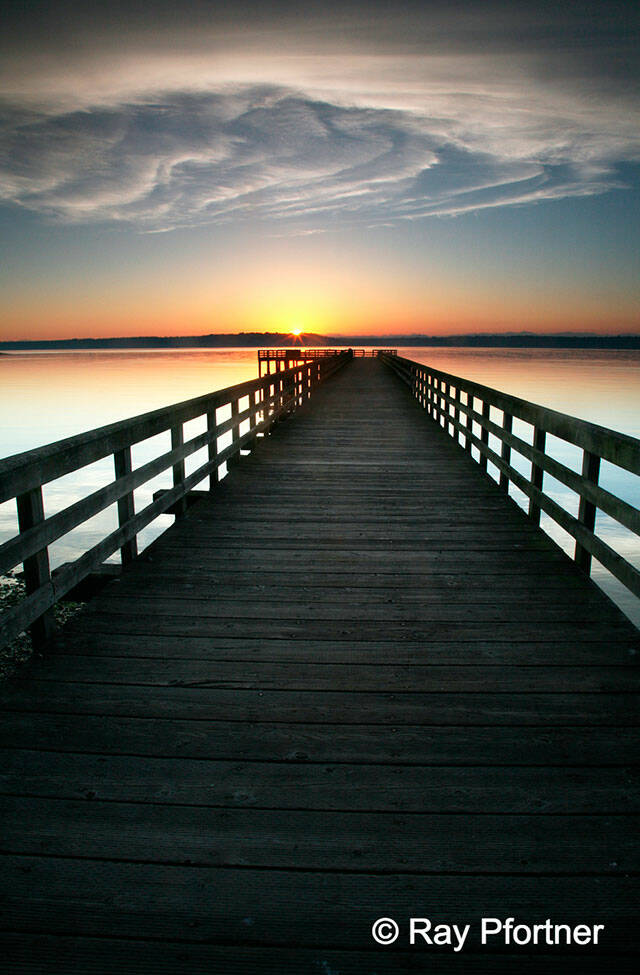 This 2006 photograph by island photographer Ray Pfortner captured the beauty of a sunrise over Tramp Harbor dock (Ray Pfortner Photo).