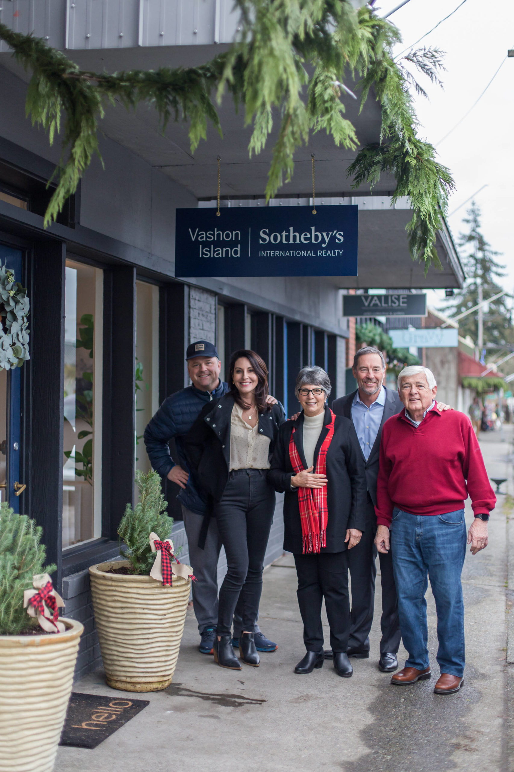 (Left to right) Preben Martin, Nicole Donnelly Martin, Linda Bianchi, Calvin Lyford, regional VP for Sotheby’s International Affiliates, and Dick Bianchi celebrate the opening of a new real estate venture in downtown Vashon (Mallory MacDonald/Maxwell Creative Photo).
