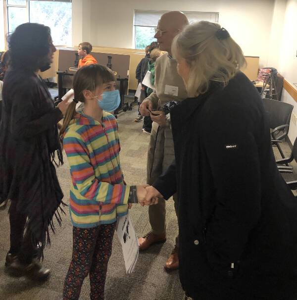 Agnes Simmons, age 9, met Gerie Wilson for the first time on Jan. 13, at a panel discussion held for third-graders at Chautauqua Elementary School. The two will be pen-pals in the next phase of a year-long project at the school (Adrianne Williams Photo).