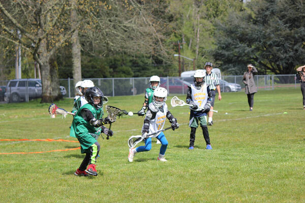 Youth complete at the Clash on Vashon, a once-a-year informal tournament that Vashon Lacrosse Club puts on for youth teams at Chautauqua Elementary School (Heidi McWatters Photo).