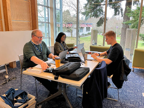 Aaron Brockschmidt (right) was among the pool of applicants who showed up to apply for a job at Vashon’s post office at a hiring fair held last week at Vashon Library (Elizabeth Shepherd Photo).
