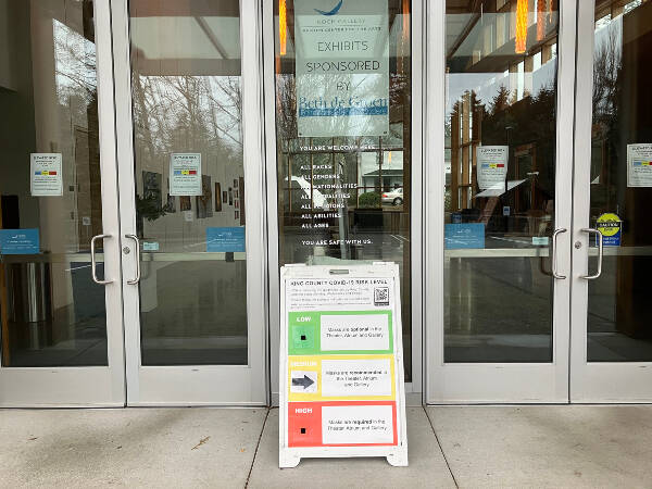 Signage at Vashon Center for the Arts, when Vashon High School’s “Snowball” dance was held, recommends that patrons wear masks, given Vashon’s current elevated risk status for COVID (Elizabeth Shepherd Photo).