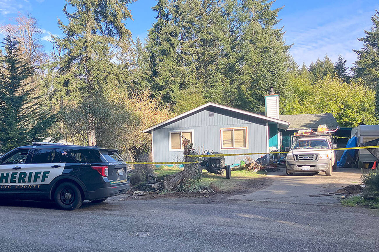 A house in Vashons Fir Ridge neighborhood, on the block where deputies say the crime took place, was sealed off with crime tape on Thursday afternoon. (Elizabeth Shepherd Photo)