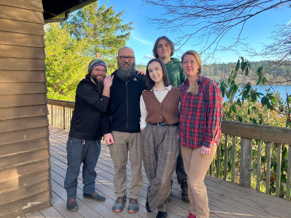 The tight-knit staff of Camp Burton (left to right), Joe Locke, Jeff Rutschow, Jevne Meyers, Gabriel Stewart and Michele Rutschow, on the deck of the camps lodge, overlooking Puget Sound (Elizabeth Shepherd).