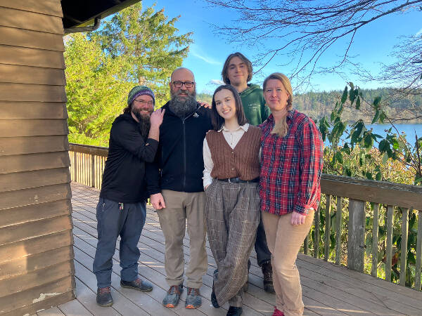 The tight-knit staff of Camp Burton (left to right), Joe Locke, Jeff Rutschow, Jevne Meyers, Gabriel Stewart and Michele Rutschow, on the deck of the camp’s lodge, overlooking Puget Sound (Elizabeth Shepherd).