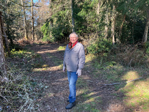 Lisa Devereau, on a walk through an undeveloped portion of Vashon Cemetery that will now become the site of approximately 40 fully green burial sites (Elizabeth Shepherd Photo).