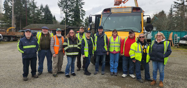 Vashon Island School District’s intrepid crew of school bus drivers — some of whom gathered for this recent group shot — are the first and last school district workers island students see during the school days (Peter Woodbrook Photo).