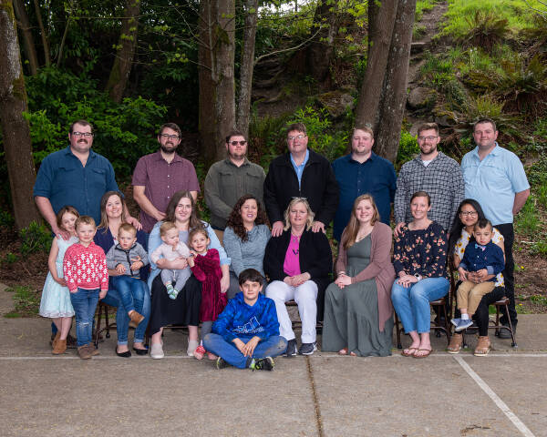 Chris Jovanovitch, seated center, surrounded by her large and loving family in early 2022 (Michael Sage Photo).