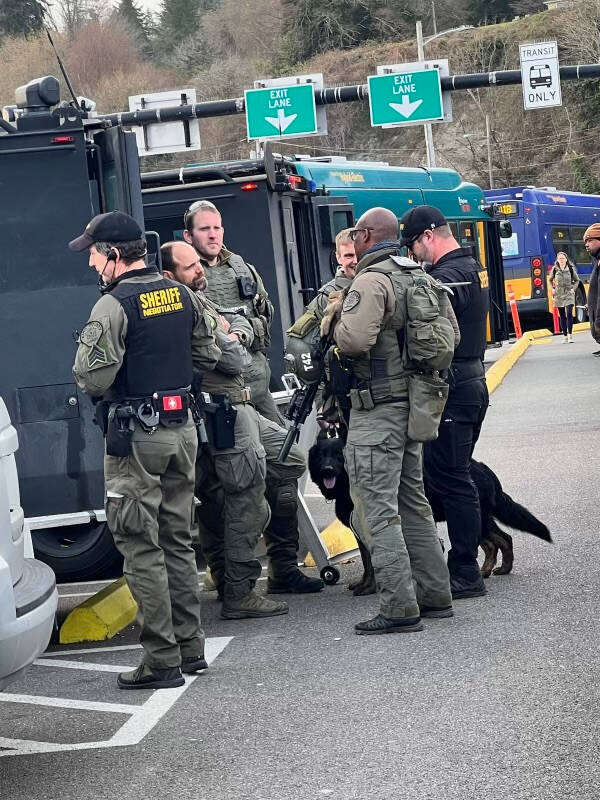 A large presence of law-enforcement officers, at the North End ferry dock, following the raid that resulted in the arrest of an islander for crimes involving human trafficking. (Courtesy Photo)