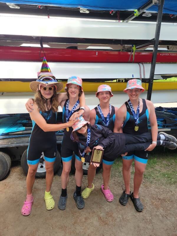 Local rowers dressed up to compete in the regatta’s high school eight race, just for fun (Courtesy photo).