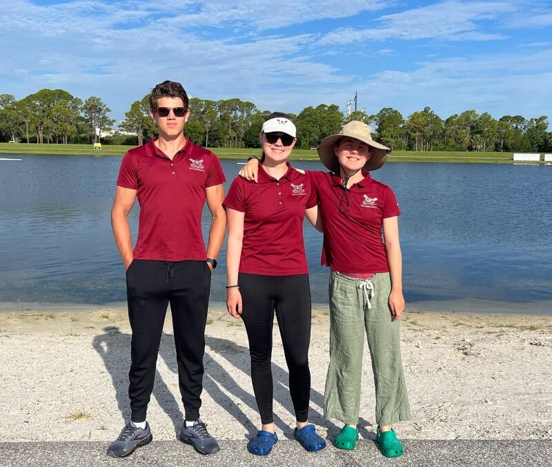 (Left to right) Grant Gonter, Ella Jones, and Ella Odegard stand in front of the waters at Nathan Benderson Park (Andrea Gonter Photo).
.