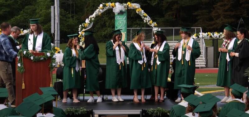 Pieces of 8 winners receive their medals at graduation (Screenshot Photo).