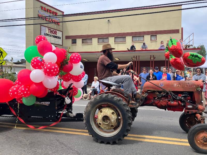 A cheer always goes up from the crowd when vintage tractors make their way down Vashon Highway during the Grand Parade (Elizabeth Shepherd Photo).