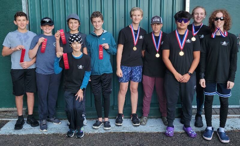 The novice winners from the Vashon Island Rowing Club stand with their ribbons and medals. From left to right: Grayson Hamilton, Alden Metler, Brendan Blower, Colin Simpson (front), Rowan Grace, Grant Fitterer, Jonas Maxfield, Tao Riley, Dorian Britz, and Finley Graham (Photo by Ben Steele).