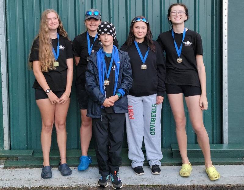 In this photo, from left to right, stand the first-place finishers of a novice girls’ squad from the Vashon Island Rowing Club: Etta Chait, Grace Pepper, coxswain Colin Simpson (front), Ren Colvos and Gwen Tomlinson.