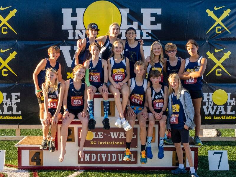 The McMurray girls and boys cross country teams at the Nike Hole in the Wall Invitational at Lakewood High School in Arlington (John Decker Photo).