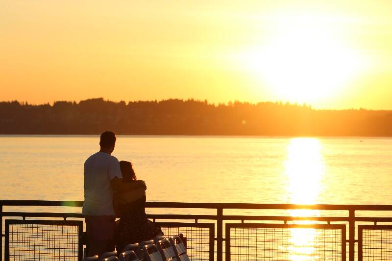 Two ferry riders enjoy the sunset and each other’s company on the ride from Tahlequah to Pt. Defiance last September (Alex Bruell Photo).