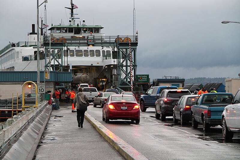Vehicles prepare to board a Washington State Ferry at the Fauntleroy dock (File Photo).