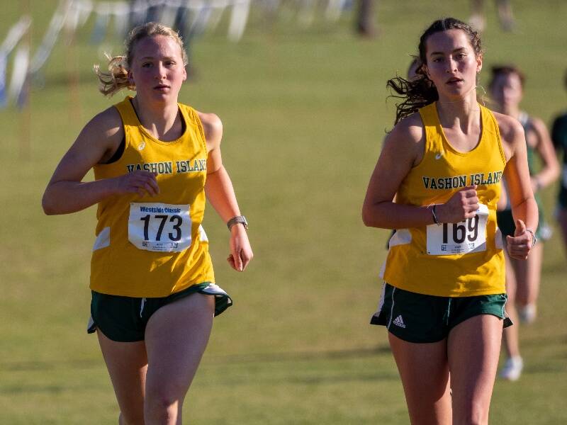 Madeline Yarkin and Cecelia Guenther race together at the District 3 Championships (John Decker Photo).
