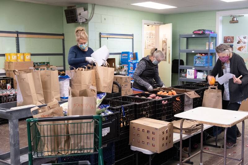 In this 2020 file photo, people with the Vashon Food Bank prepare pick-up and deliveries for community members. The food bank is in need of a new facility, its organizers say, and they plan to upgrade their operations by moving to the Vashon United Methodist Church.