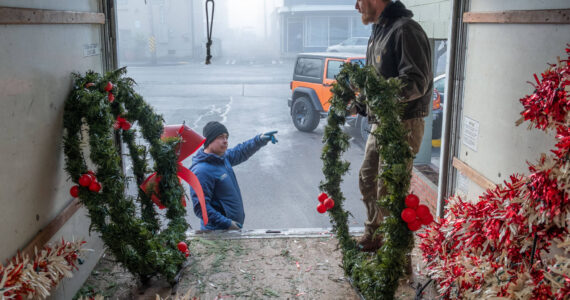 Eloy Carrillo and Nate Schafer distribute Island Christmas decorations for installation and hanging for the Vashon Chamber of Commerce. Terry Donnelly photo