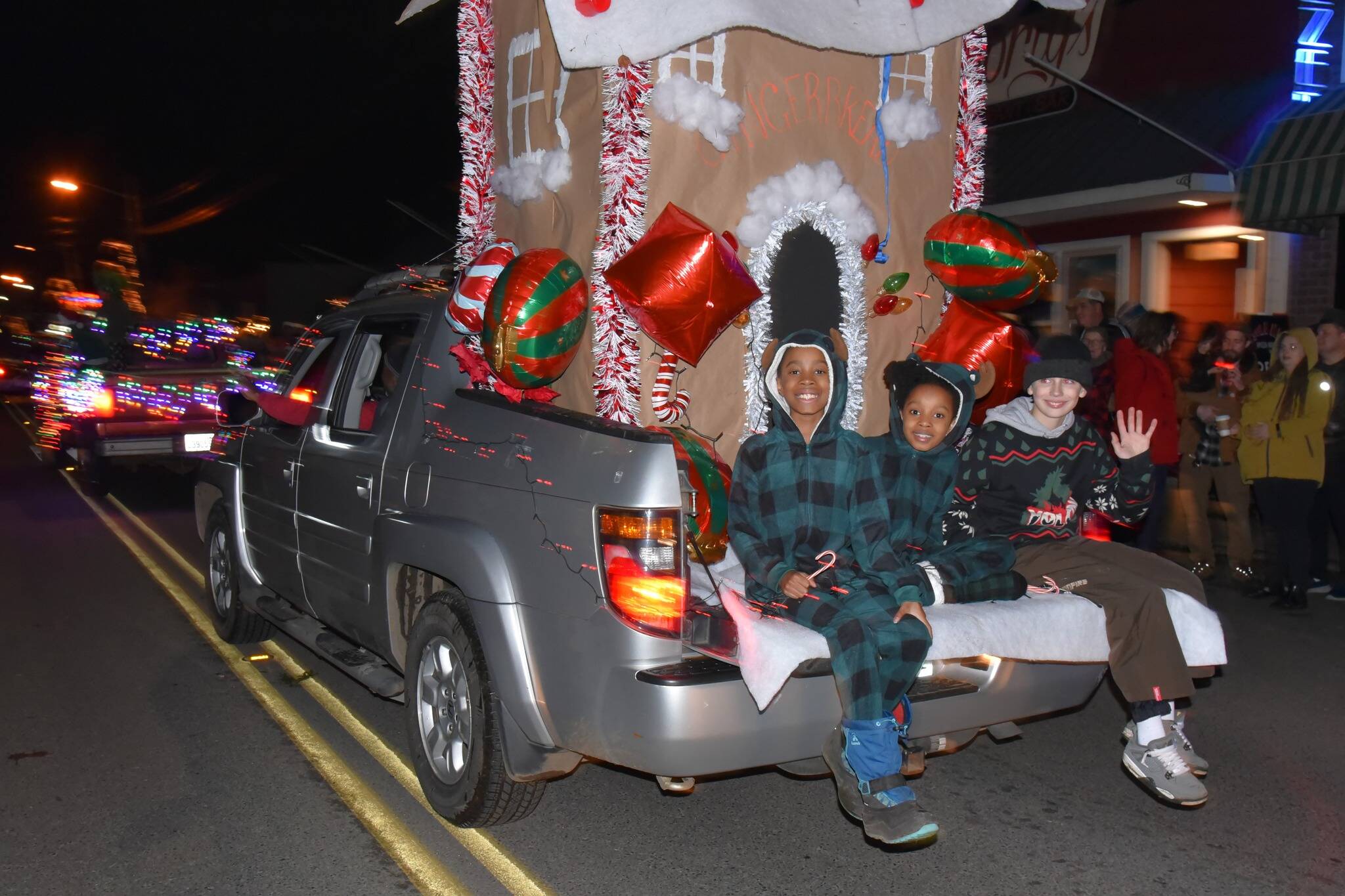 Jim Diers photo
Kids smile for the camera while riding down Vashon Highway SW during the WinterFest parade.