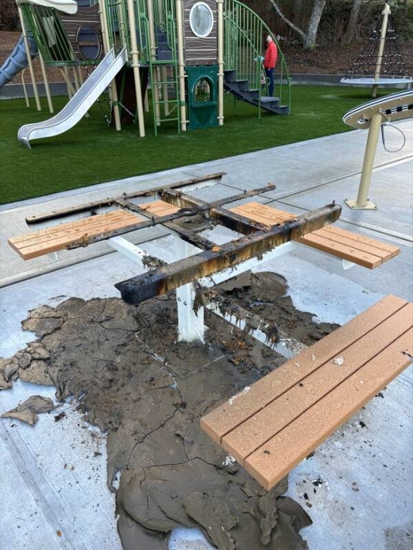 A table at the new Dockton Park Playground was incinerated sometime overnight between Saturday, Dec. 30 and the following Sunday, according to Vashon Island Fire and Rescue (VIFR). Whatever burned the table reached a temperature so hot that the top of the table appears as if it melted from its metal reinforcements (Photo courtesy VIFR).
