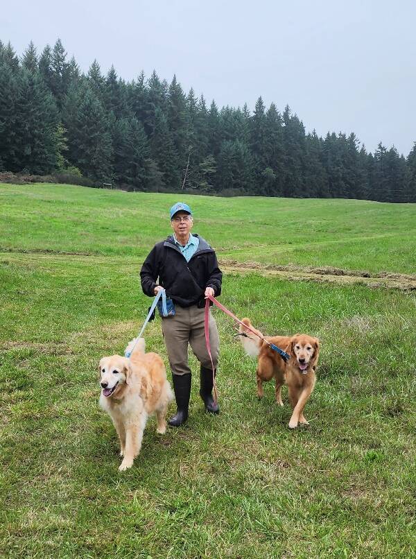 Ethan Russo, with his dogs Taffy and Benson, at the south end of Wax Orchard Park (Photo Courtesy Ethan Russo).