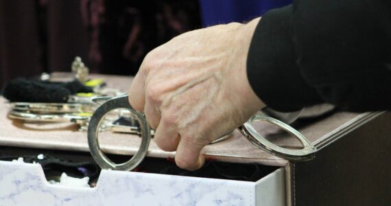 Alex Bruell photo
A shopper peruses a pair of handcuffs.