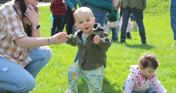It’s all smiles for this carrot-and-bunny-jammies wearing kid after the annual Easter Egg hunt at Ober Park. Alex Bruell photo.