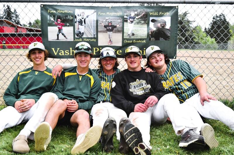 From left to right, sitting underneath pictures of their younger selves during senior night, are Finn Hawkins, Jack Harvey, Finn Magonegil, Chase Bradrick and Will Frith (Pam Stenerson photo).