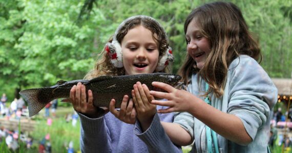 Alex Bruell photo
Gwendolyn Rose, 8 (left) and Joss Moe, 8, marvel at the trout that Gwendolyn caught and Joss reeled in.