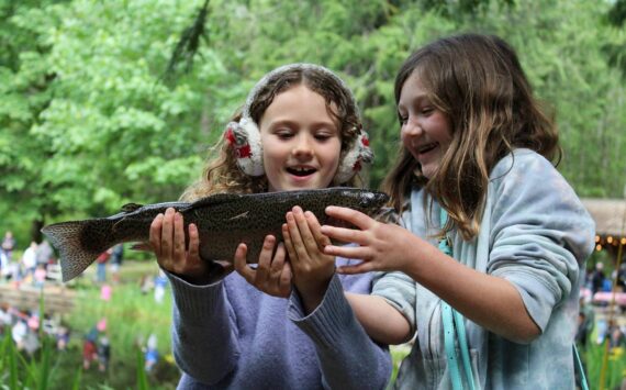 Alex Bruell photo
Gwendolyn Rose, 8 (left) and Joss Moe, 8, marvel at the trout that Gwendolyn caught and Joss reeled in.