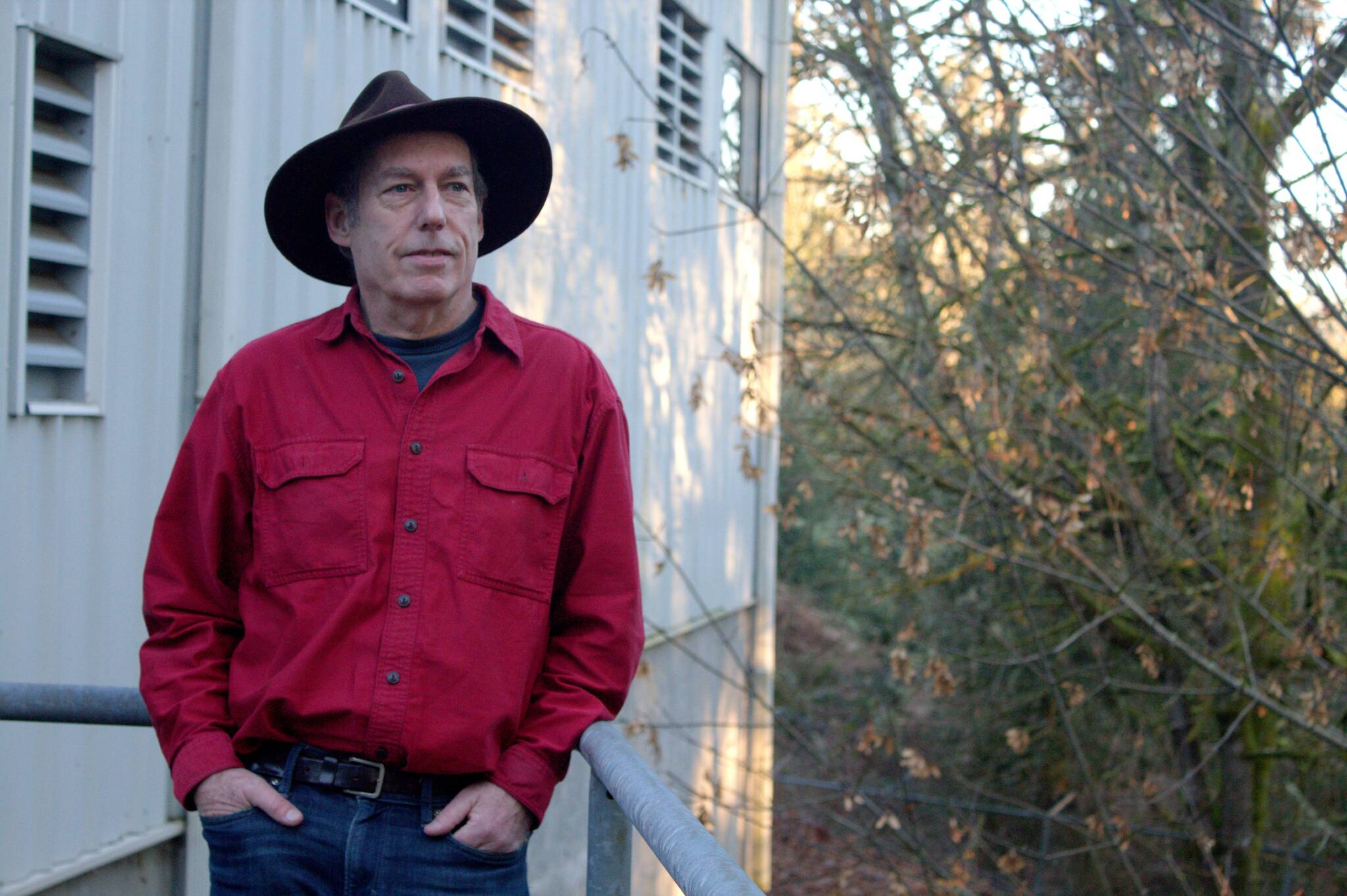 Water District 19 commission board president Seth Zuckerman poses for a photo outside the district’s treatment plant on Beall Road and Bank Road. In light of the Palisades Fire, the commission wants to ensure that District 19, the largest purveyor of water on Vashon, has access to enough water should the island face a large fire, and it has requested a fire resilience assessment from the King Conservation District. (Alex Bruell photo.)