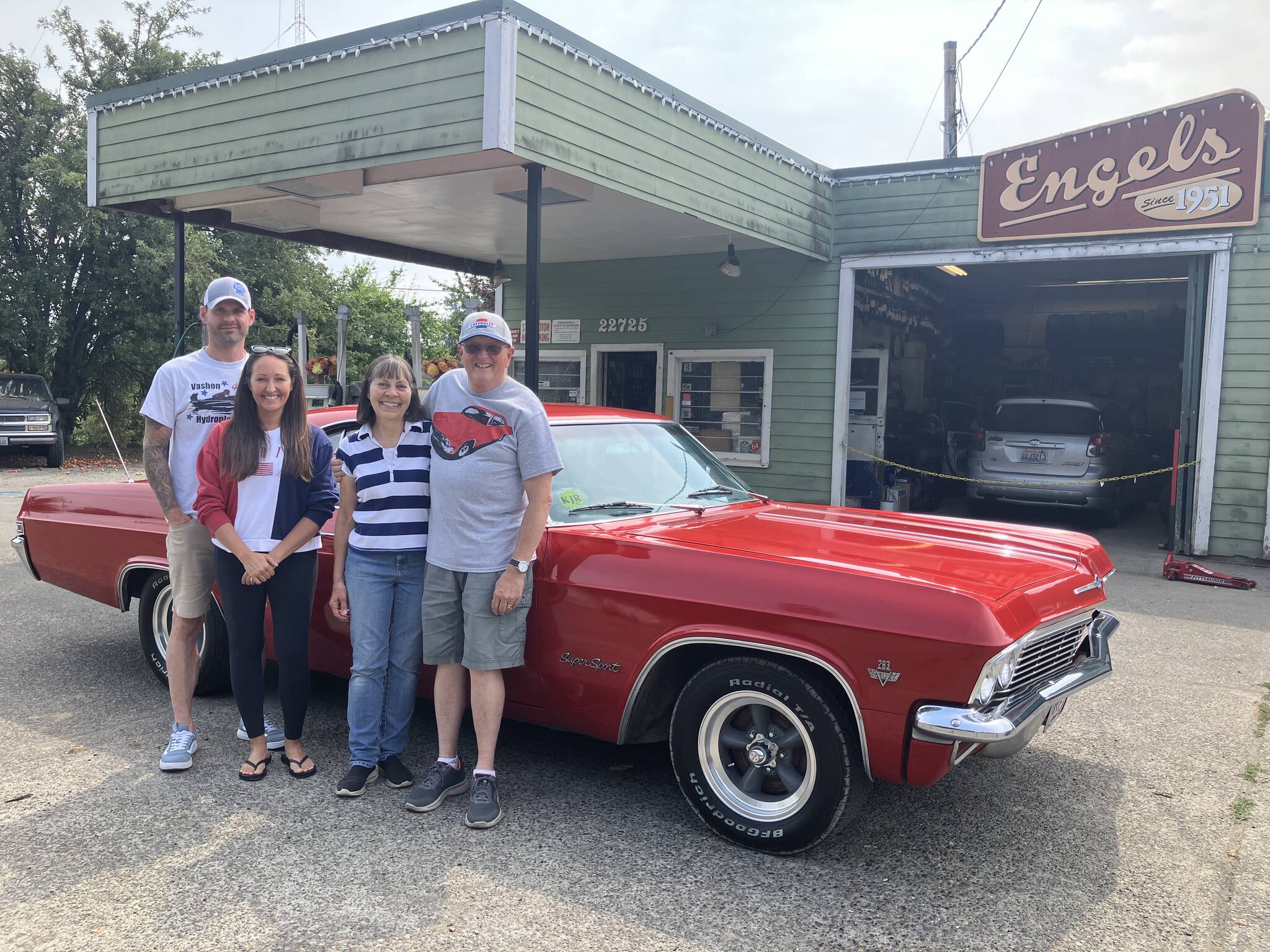 Randy Wallenberg’s 1965 rally red Chevy Impala Super Sport has been named as the official show car of this year’s Engels Car Show. Last week, Wallenberg (far right) proudly showed off the car at Engels Repair and Towing with (from left) his son-in-law Alex Nybo, daughter Krista Wallenberg and wife Cynthia Wallenberg, marking a new milestone for the car. (Elizabeth Shepherd photo)