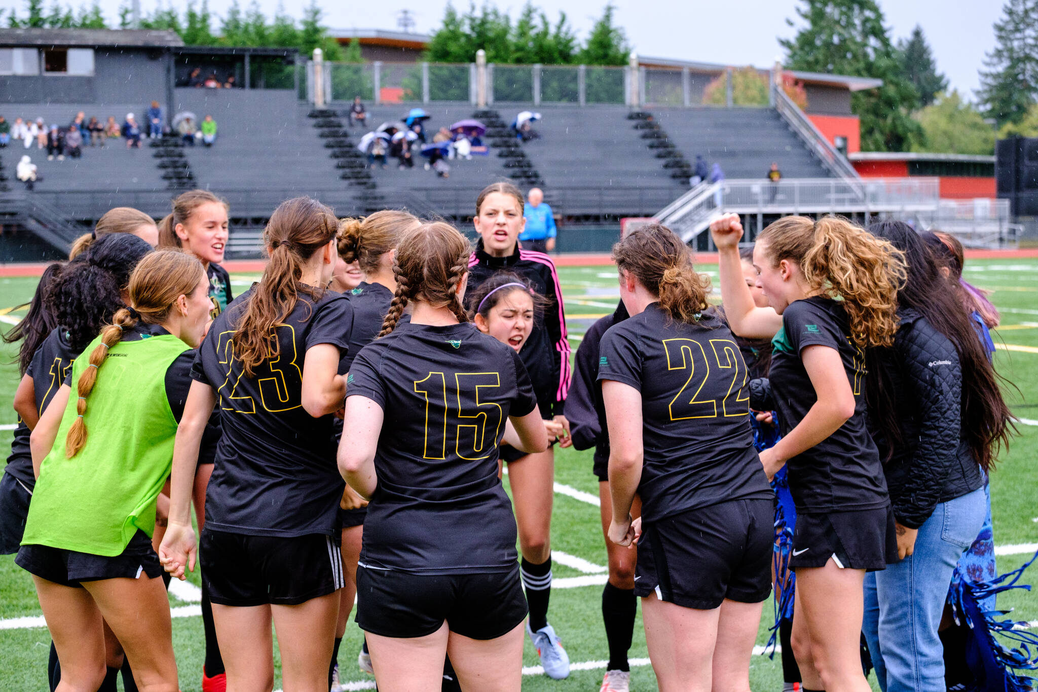 Junior and co-captain Lillith Provo leads the huddle before kickoff. (Dawn Stief Photo)
