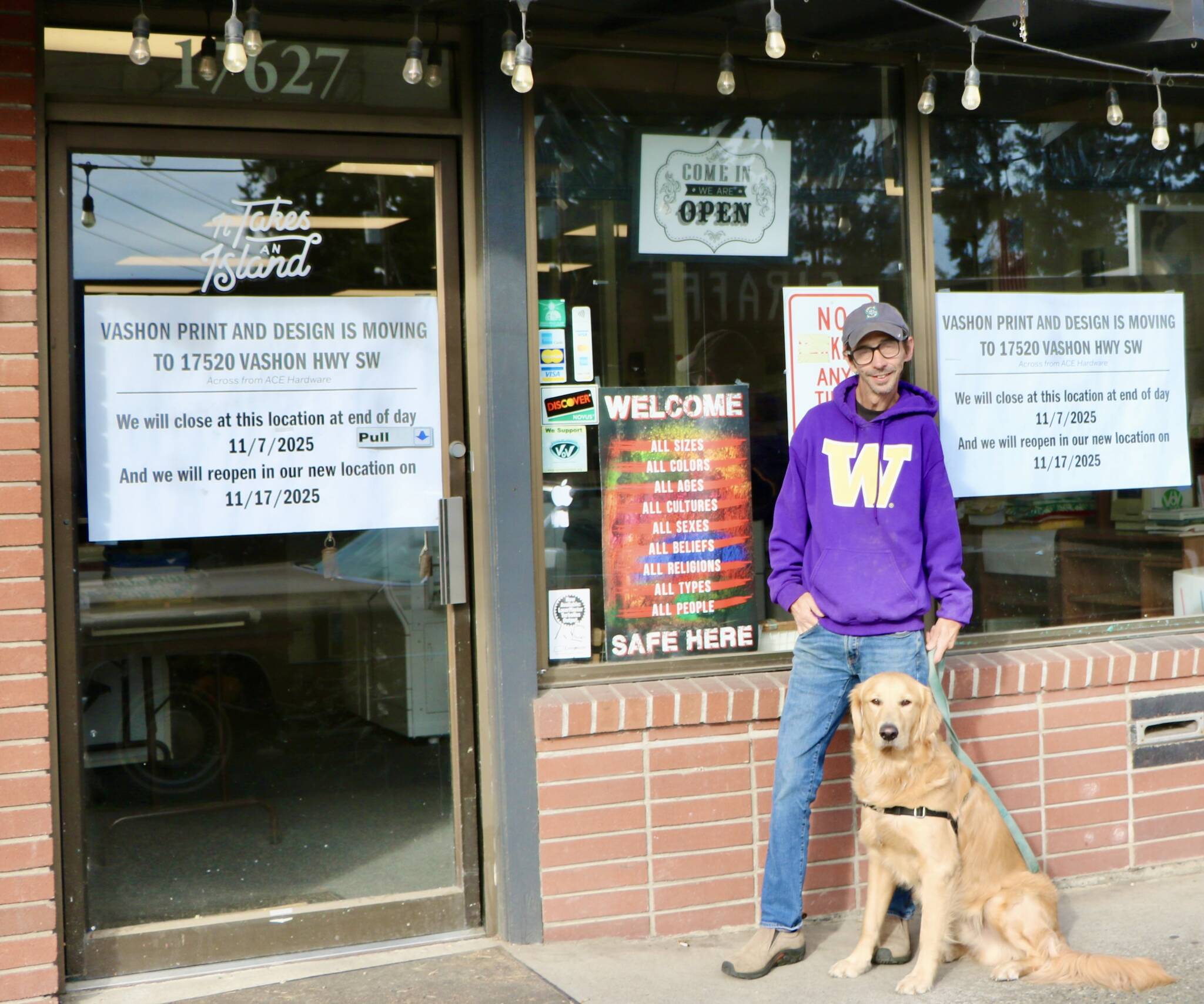 David Henschman and his golden retriever, Bodhi, stand outside Vashon Print Design, the longtime uptown print shop preparing to move to a new location. (Aspen Anderson Photo)