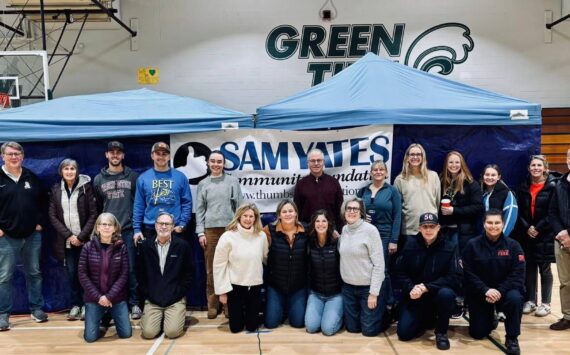 Courtesy Photos
Jill Yates (fourth from left, kneeling) and the team of volunteers assembled for a heart screening event held on Nov. 4 at Vashon High School.