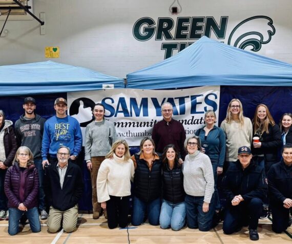 Courtesy Photos
Jill Yates (fourth from left, kneeling) and the team of volunteers assembled for a heart screening event held on Nov. 4 at Vashon High School.